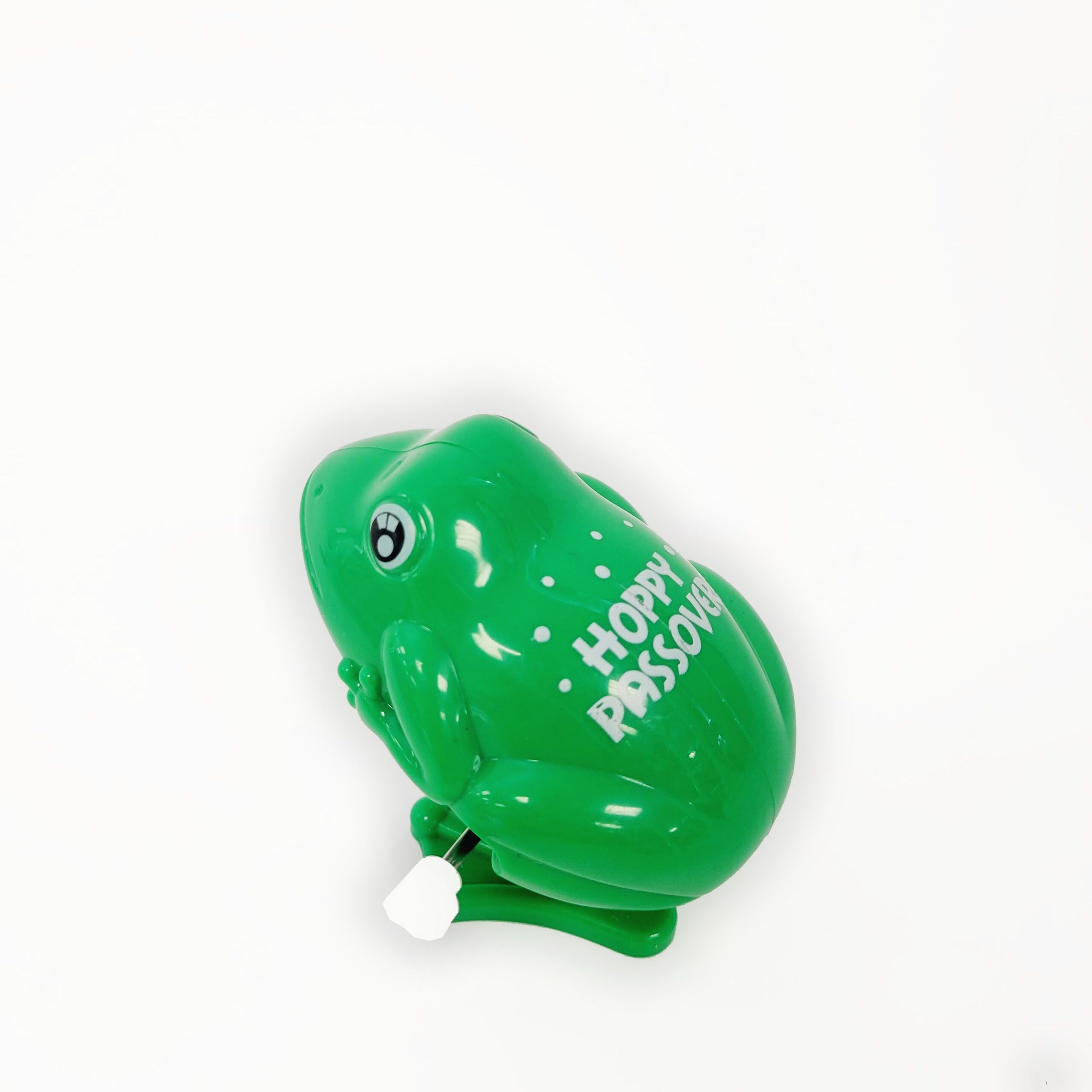 083dcd9e26a24ff6938289f2110727ff.jpg WIND UP "HOPPY PASSOVER" FROG,PLASTIC,2.5",CARDED - Image 1